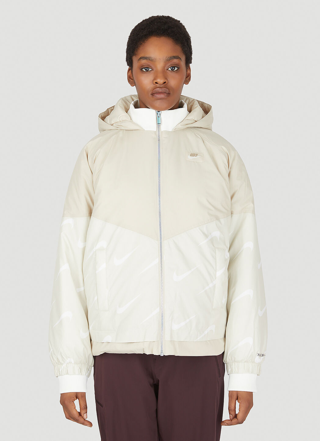 Nike Women's Therma Fit Icon Clash Hooded Jacket in Beige
