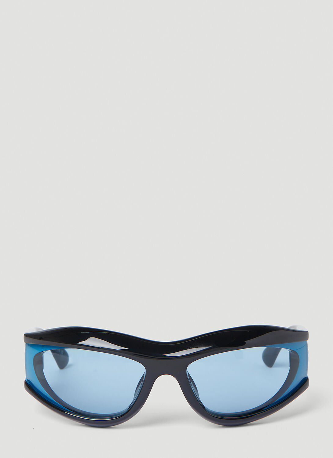 Bottega Veneta® Pleat Wraparound Sunglasses in Light Blue. Shop online now.