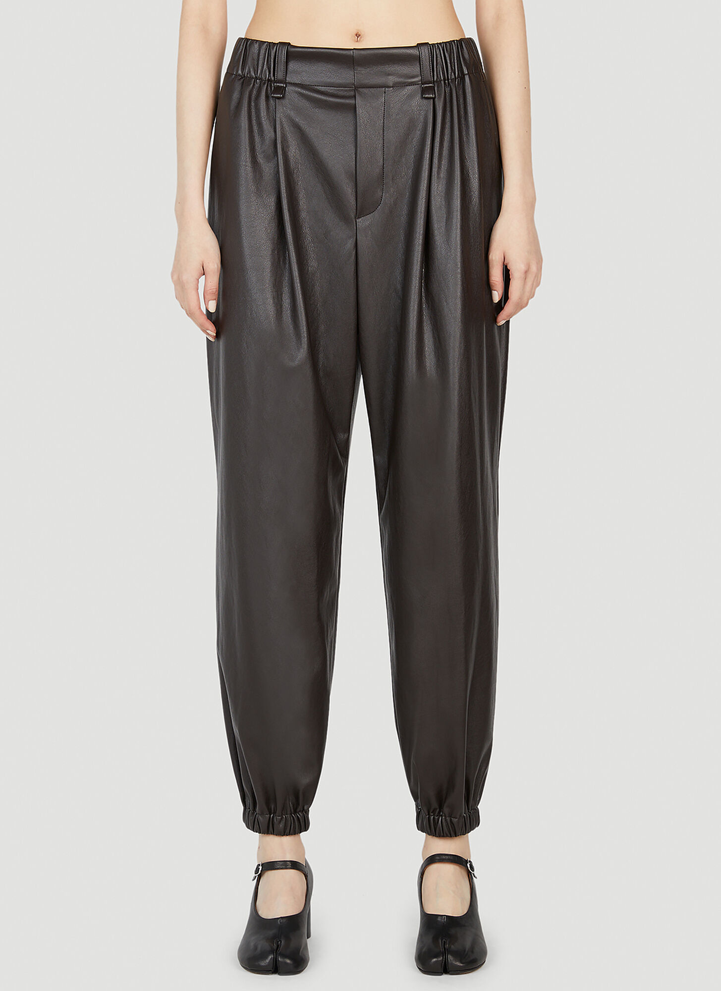 Issey Miyake Faux-leather Jogger Trousers In Brown